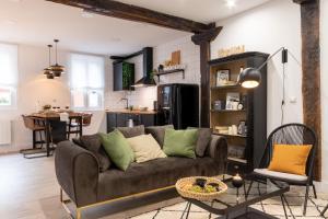 a living room with a couch and a kitchen at River Apartment in the heart of Bilbao EBI-01297 in Bilbao