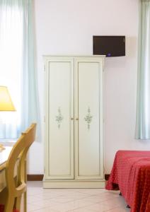 a white cabinet with snowmen on it in a room at Guesthouse Ca' San Marcuola 1 in Venice
