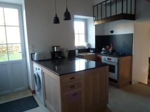 A kitchen or kitchenette at Le Logis de Miserè