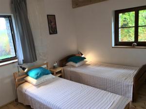 Posteľ alebo postele v izbe v ubytovaní Spichlerz Nad Jeziorem Dadaj Mazury