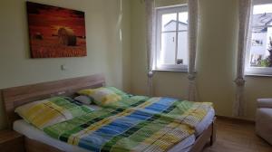 Ein Bett oder Betten in einem Zimmer der Unterkunft Ferienhof Lahr