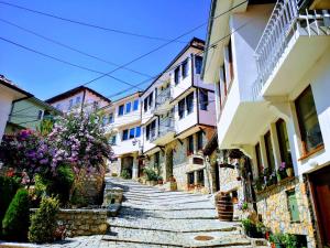 a cobblestone street in a town with buildings at Villa & Winery Mal Sveti Kliment in Ohrid