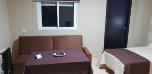 Łóżko lub łóżka w pokoju w obiekcie Hostal Málaga