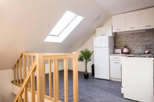 Kuchyňa alebo kuchynka v ubytovaní Csigaház Apartman