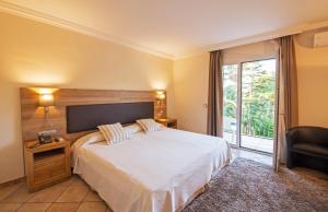 Postel nebo postele na pokoji v ubytování Hotel Cap Roig & Spa by Brava Hoteles