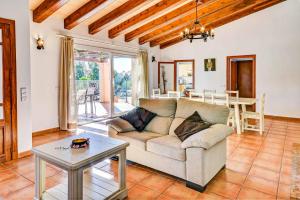a living room with a couch and a table at Casa Calonge in Felanitx
