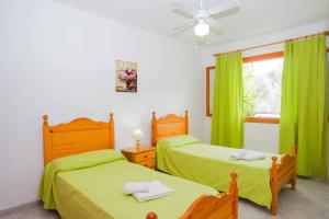 Postel nebo postele na pokoji v ubytování Villa Punta des Port Catorce