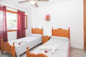 Postel nebo postele na pokoji v ubytování Villa Punta des Port Catorce