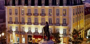 a statue of a man in front of a building at Love inn Bairro Alto 4 in Lisbon