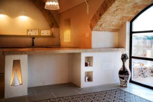 A kitchen or kitchenette at Dimora Sighé, exclusive rural villa with hydromassage pool