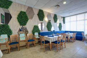Een restaurant of ander eetgelegenheid bij Paraiso Theopolis - All Inclusive