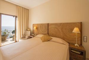 
Кровать или кровати в номере Hotel Cap Roig by Brava Hoteles

