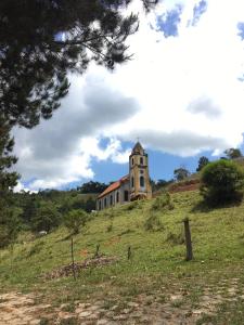 an old building on top of a hill at Pousada do Vale in Joanópolis