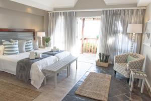 Postel nebo postele na pokoji v ubytování Whalesong Hotel & Spa
