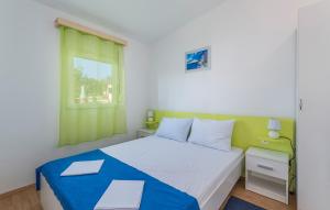 Postel nebo postele na pokoji v ubytování Holiday Park Village Jelovci + 101 fotografií