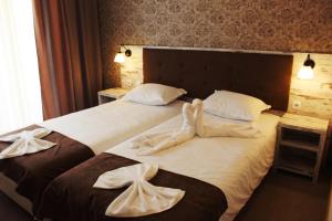 Een bed of bedden in een kamer bij Paraiso Theopolis - All Inclusive