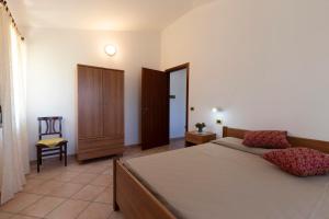 Postel nebo postele na pokoji v ubytování Villa Dei Pini