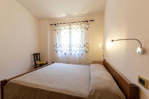 Postel nebo postele na pokoji v ubytování Villa Dei Pini