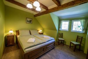 A bed or beds in a room at Pension GRANTL