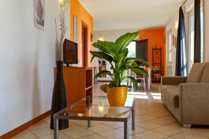 A television and/or entertainment centre at Residence La Collina