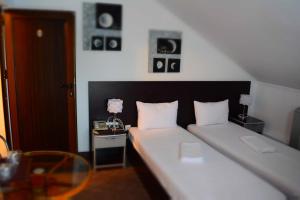 Postel nebo postele na pokoji v ubytování Motel Anghel