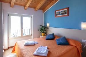 A bed or beds in a room at Residence La Collina Még 37 kép