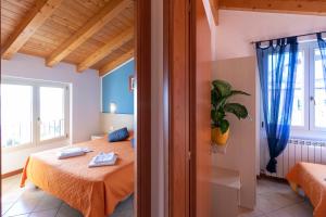 A bed or beds in a room at Residence La Collina