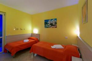 A bed or beds in a room at Residence La Collina