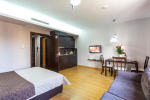 Katil atau katil-katil dalam bilik di CityHome Aparthotel