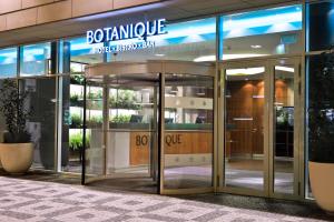an entrance to a building with a revolving door at Botanique Hotel Prague in Prague