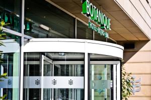 a store front of a building with a sign on it at Botanique Hotel Prague in Prague