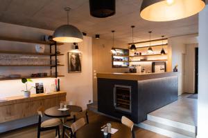 a restaurant with tables and chairs and a fireplace at VIGEO lounge b&b coffee in Bojnice