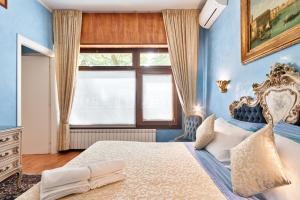 Postel nebo postele na pokoji v ubytování BB Venezia
