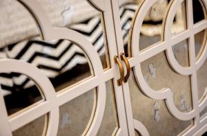a close up of a door with a gold handle at Singer Palace Hotel in Rome