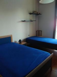Postel nebo postele na pokoji v ubytování B&B Villa Le Palme Scalea