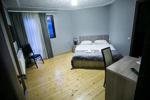 Rúm í herbergi á Soncho Kazbegi
