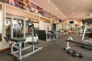 a gym with several treadmills and weights at Ocean Maya Royale Adults Only - All Inclusive in Playa del Carmen