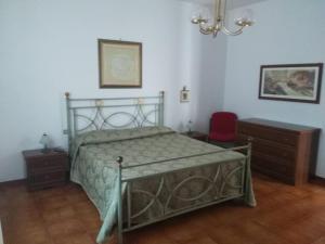 Postel nebo postele na pokoji v ubytování B&B Villa Le Palme Scalea