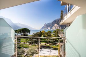 a balcony with a view of the ocean at Hotel Bellariva in Riva del Garda