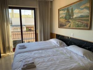A bed or beds in a room at Apartamentos Torr en Madrid - Chamartín