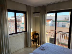 A bed or beds in a room at Apartamentos Torr en Madrid - Chamartín