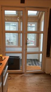 a room with sliding glass doors in a house at Rheingau - schöne möblierte Ferienwohnung in Eltville