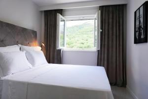 Posteľ alebo postele v izbe v ubytovaní SoL Rooftop Apartments