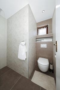 a bathroom with a toilet and a shower at Villa Dalmatino in Pakoštane