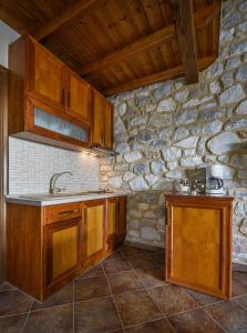 A kitchen or kitchenette at Abelos Villas Még 37 kép
