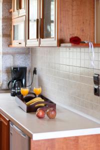 A kitchen or kitchenette at Abelos Villas