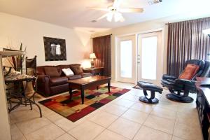 a living room with a couch and a table at The Guadalupe Escape in New Braunfels