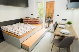 Posteľ alebo postele v izbe v ubytovaní Apartmány Stožec - Bella Premium