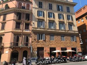 a group of motorcycles parked in front of a building at Elle Cavour Guest House in Rome