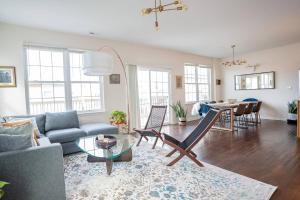 a living room with a couch and a table at NEW Luxury Quiet Island Atlantic City Getaway in Atlantic City